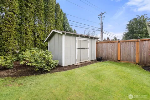 a view of a backyard with potted plants