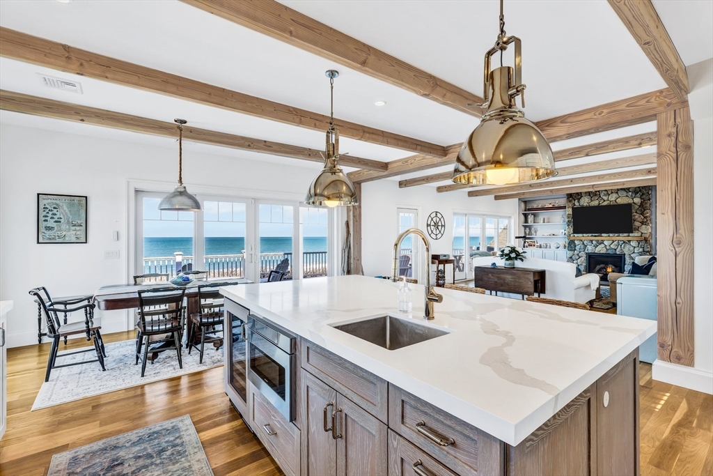 57 Salt Marsh Road Sandwich, MA 02537 - Photo 12 of 41 a kitchen with lots of counter top space and wooden floor