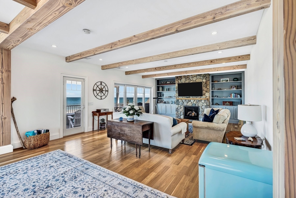 57 Salt Marsh Road Sandwich, MA 02537 - Photo 17 of 41 a living room with furniture and a flat screen tv