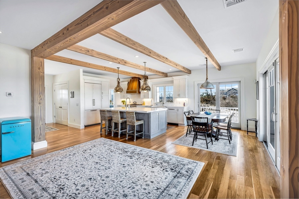 57 Salt Marsh Road Sandwich, MA 02537 - Photo 19 of 41 a living room with dining room and wooden floor