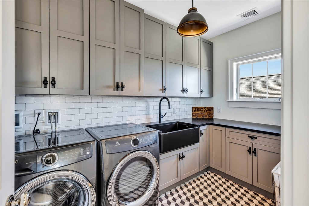 57 Salt Marsh Road Sandwich, MA 02537 - Photo 20 of 41 a kitchen with a sink a stove and cabinets