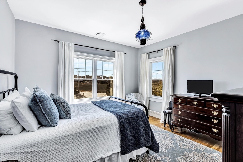 57 Salt Marsh Road Sandwich, MA 02537 - Photo 23 of 41 a bedroom with bed and flat screen tv