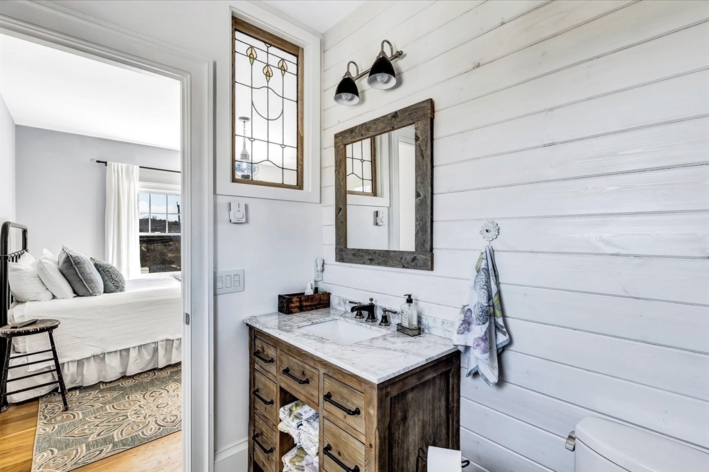 57 Salt Marsh Road Sandwich, MA 02537 - Photo 25 of 41 a bathroom with a sink and a mirror