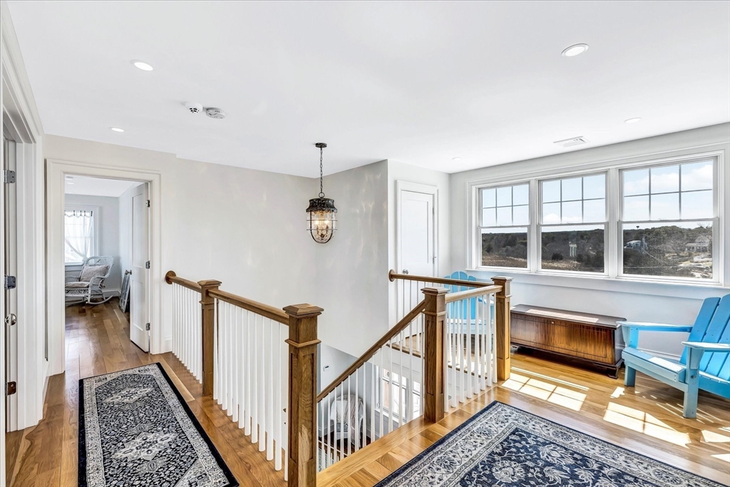 57 Salt Marsh Road Sandwich, MA 02537 - Photo 27 of 41 a view of a hallway with furniture and floor to ceiling window