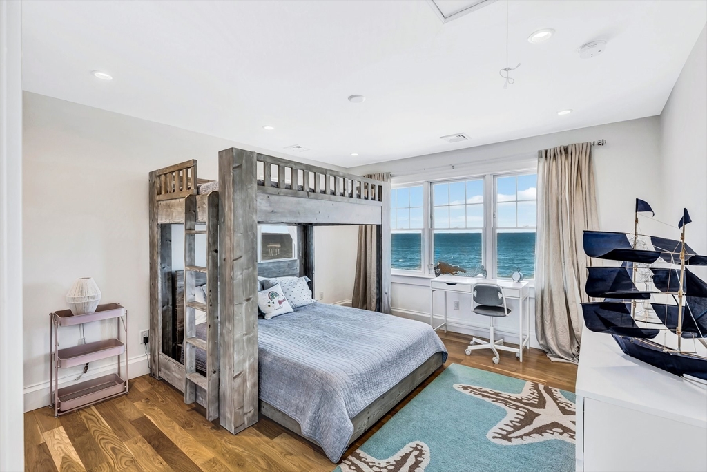 57 Salt Marsh Road Sandwich, MA 02537 - Photo 28 of 41 a bed room with a bed and a large window