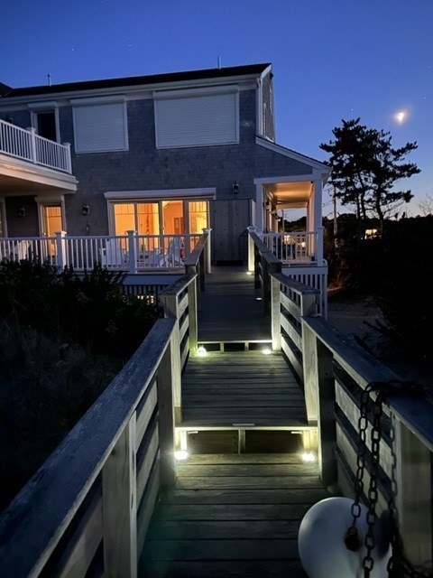 57 Salt Marsh Road Sandwich, MA 02537 - Photo 40 of 41 a living room with furniture flat screen tv and a fireplace