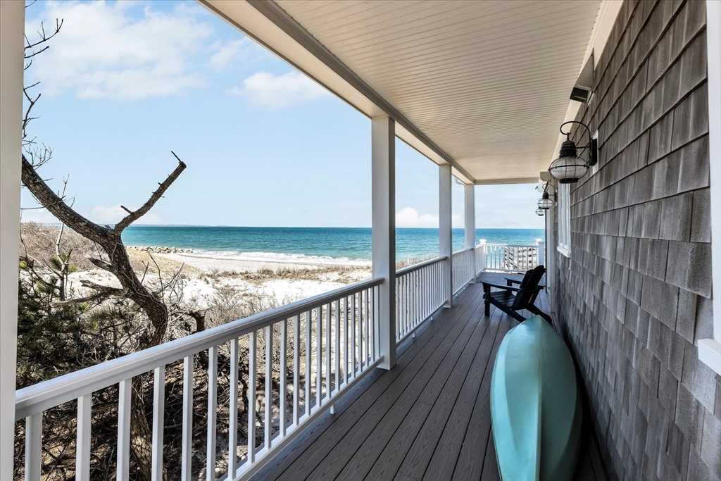 57 Salt Marsh Road Sandwich, MA 02537 - Photo 7 of 41 a view of a balcony with wooden floor