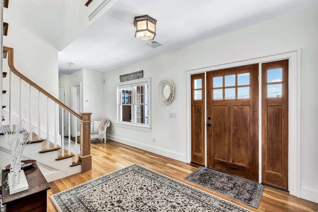 57 Salt Marsh Road Sandwich, MA 02537 - Photo 10 of 41 a view of a hallway with wooden floor and a livingroom