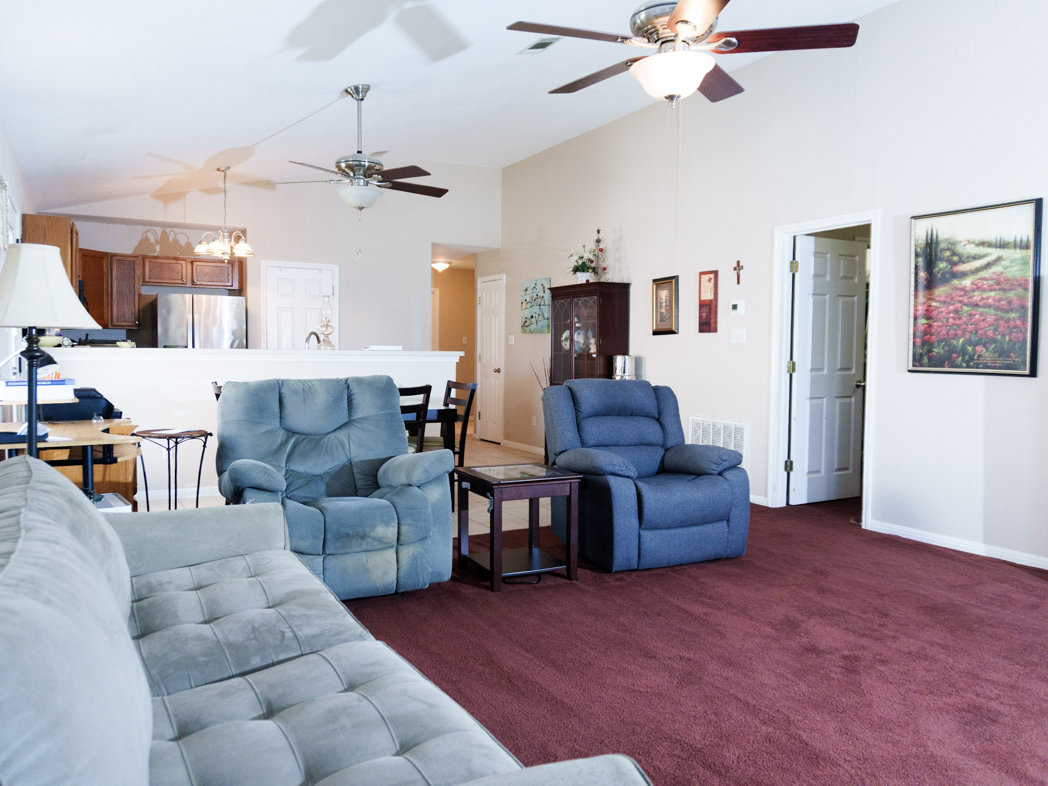 800 Debra Drive Taylor, TX 76574 - Photo 4 of 17 Living room with high vaulted ceiling and carpet floors