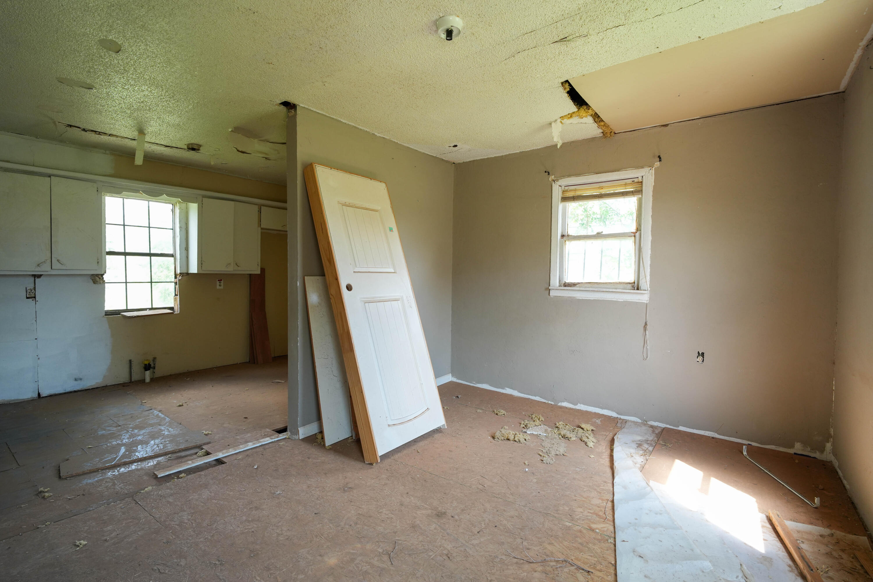2812 Emory Street Lubbock, TX 79415 - Photo 2 of 6 an empty room with windows