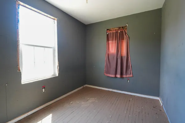 an empty room with window