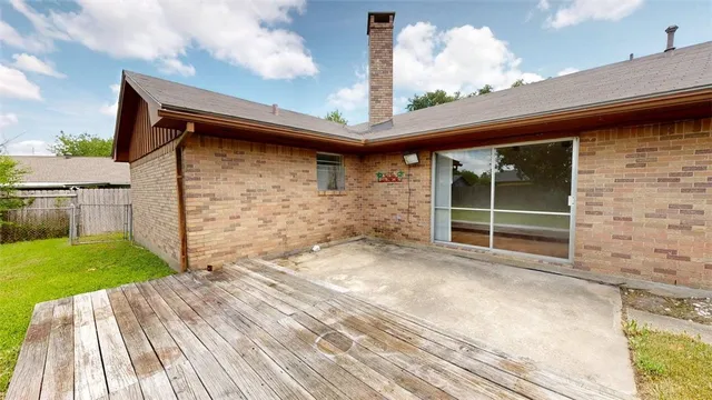 a view of a house with swimming pool and sitting area