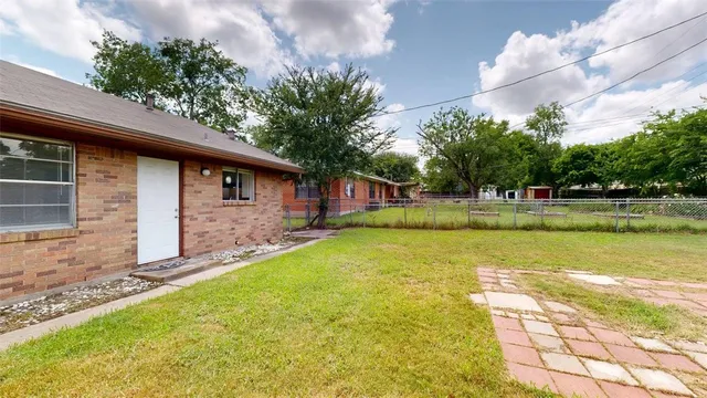 a swimming pool with wooden fence