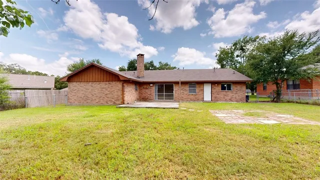 a view of a park with large trees
