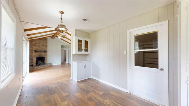 a view of a livingroom with wooden floor