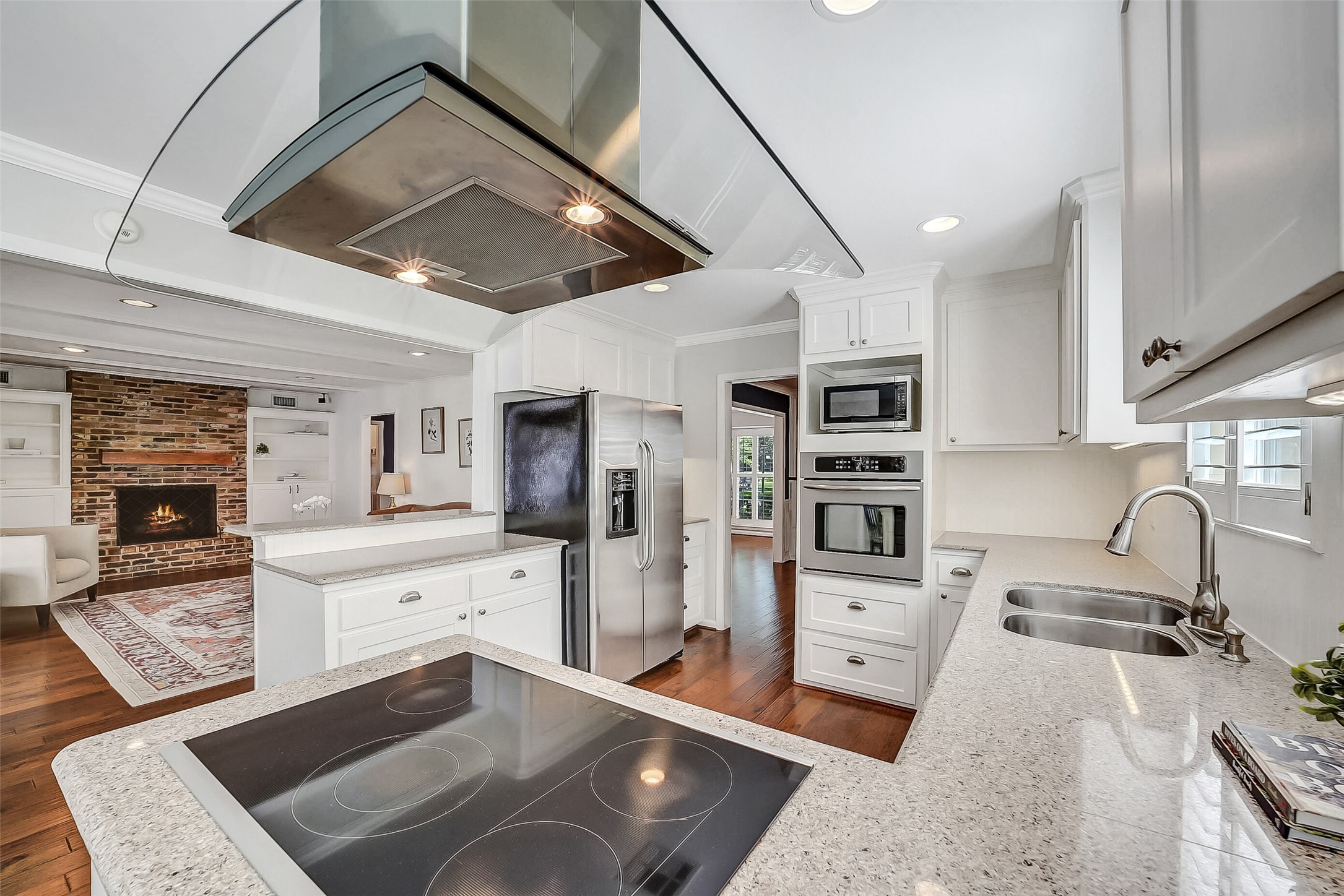 10026 Overbrook Lane Houston, TX 77042 - Photo 29 of 29 Closer up view of the kitchen showing the open floor plan with the family room on the left; ideal for entertaining and everyday living.