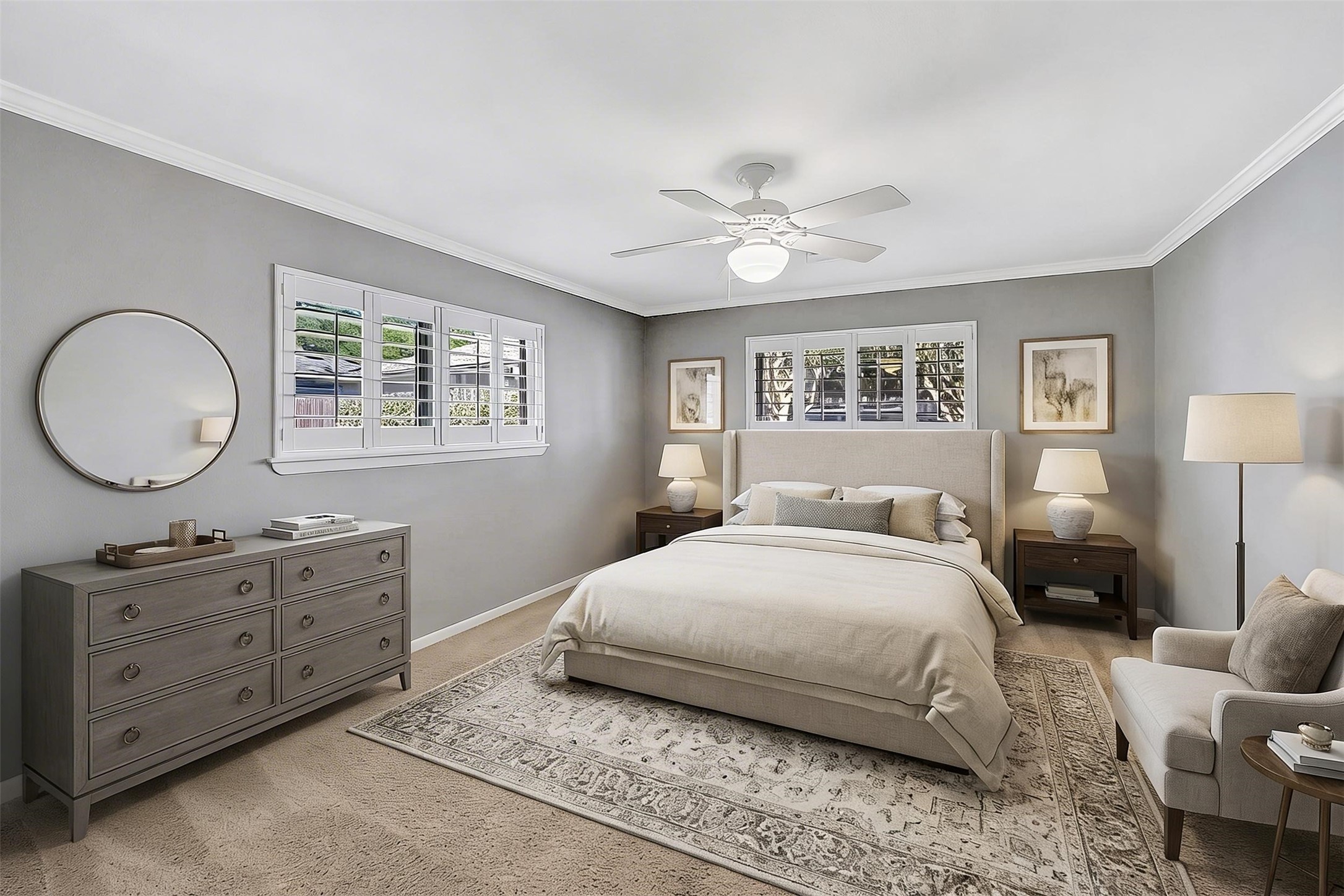 10026 Overbrook Lane Houston, TX 77042 - Photo 18 of 29 Spacious primary suite tucked at the back of the home, offering peaceful views overlooking the lush backyard. Large windows w/ plantation shutters fill the room w/ natural light, creating a bright yet relaxing retreat. Designed for comfort and functionality, the primary suite features a ceiling fan w/ light fixture and a beautifully reimagined walk-in closet by California Closets w/ built-in drawers and adjustable shelving for optimal organization. This photo is virtually staged.