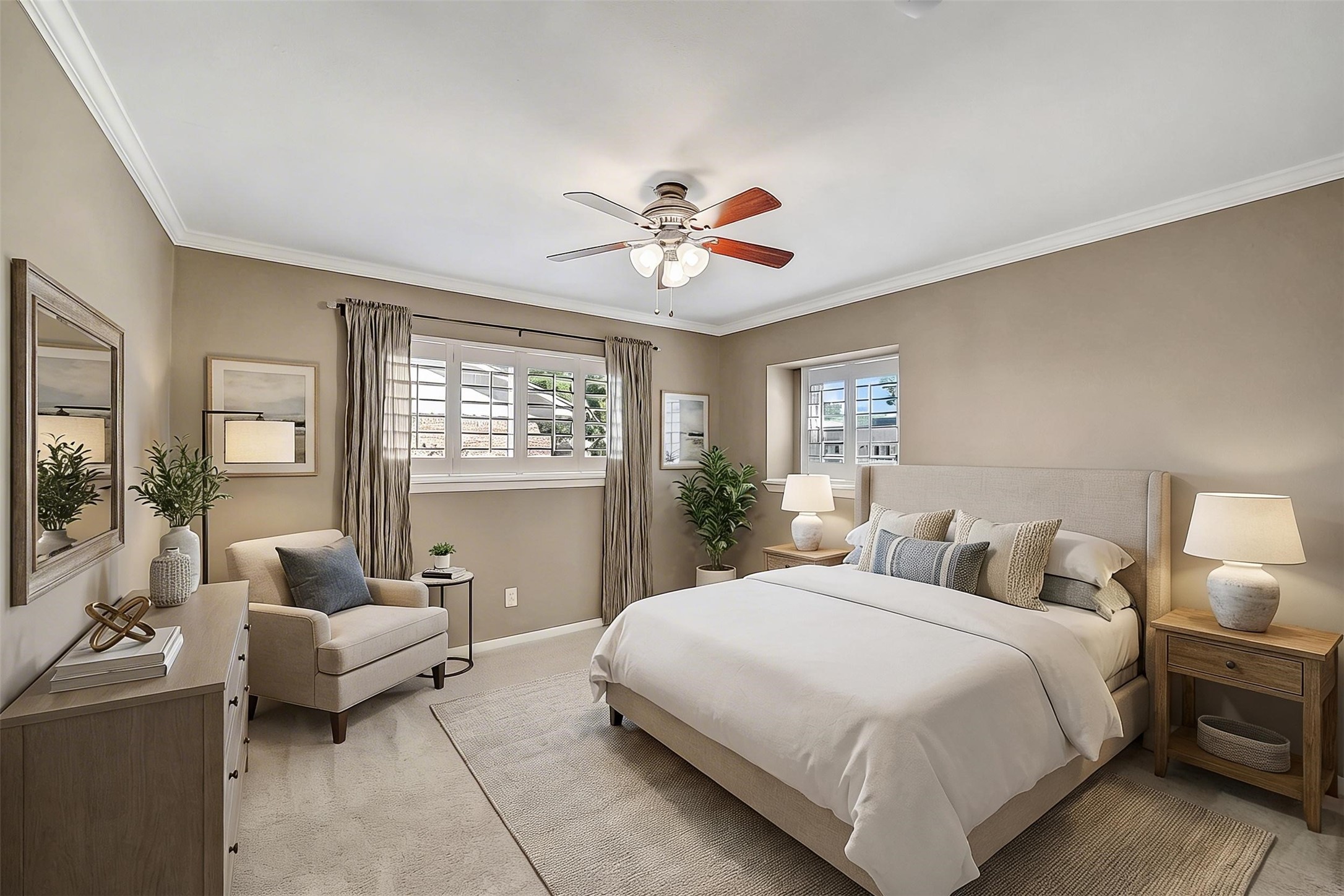 10026 Overbrook Lane Houston, TX 77042 - Photo 21 of 29 Well-appointed secondary bedroom #1 features crown molding, plantation shutters, and two large windows that fill the space w/ natural light. Ceiling fan w/ light fixture adds comfort, while the walk-in closet—redesigned by California Closets—offers built-in shelving, hanging space, and its own window. Soft carpet underfoot completes the space. This photo is virtually staged.