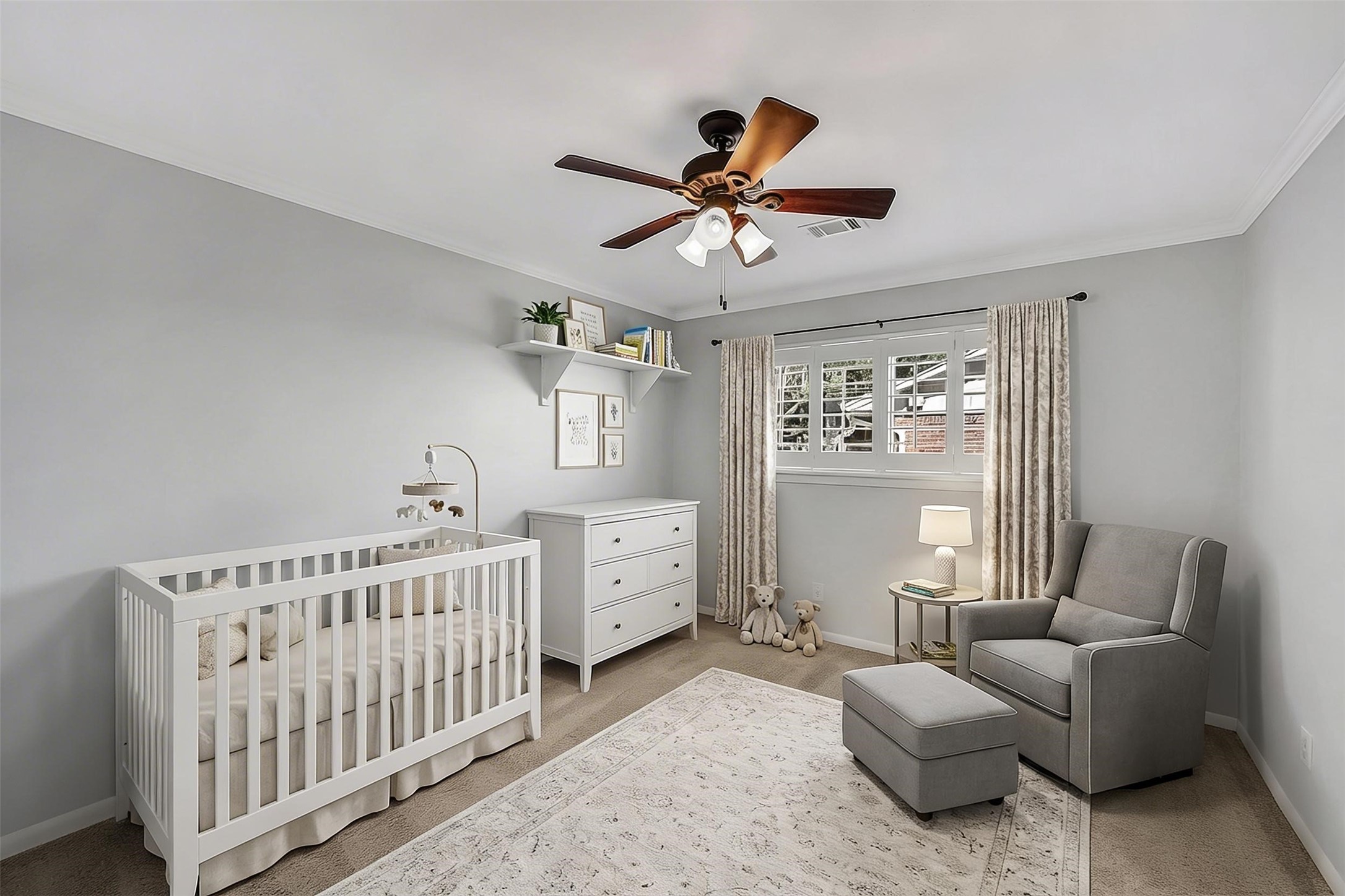 10026 Overbrook Lane Houston, TX 77042 - Photo 23 of 29 Charming secondary bedroom #2 features crown molding and a ceiling fan w/ light fixture for added comfort. Window w/ plantation shutters brings in natural light, while the double door closet—redone by California Closets—offers built-in organization for everyday ease. This photo is virtually staged.
