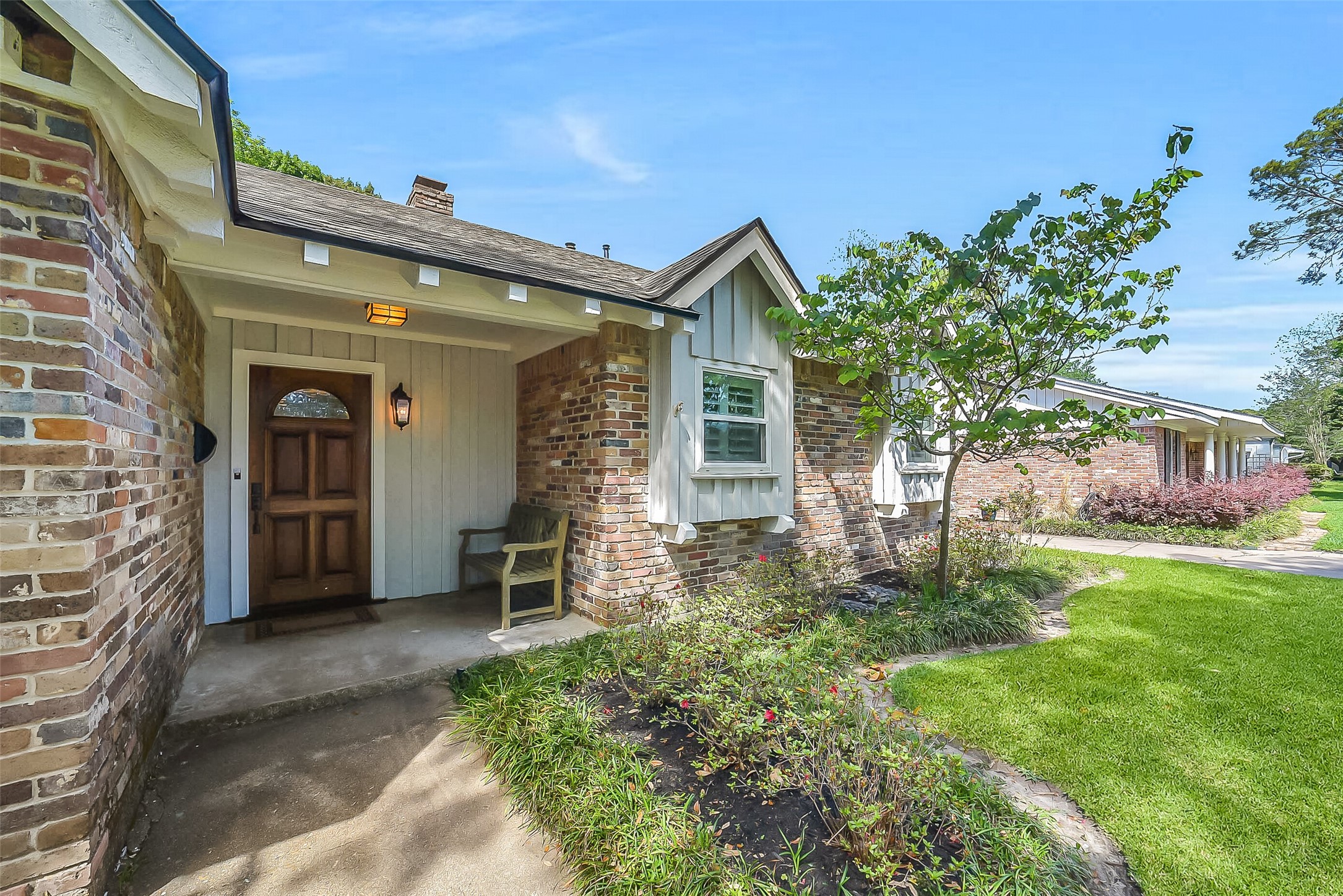 10026 Overbrook Lane Houston, TX 77042 - Photo 4 of 29 The welcoming covered front porch creates the perfect space to enjoy morning coffee or unwind in the evenings. Framed by mature landscaping, this inviting entry adds warmth and charm to the home’s already impressive curb appeal.