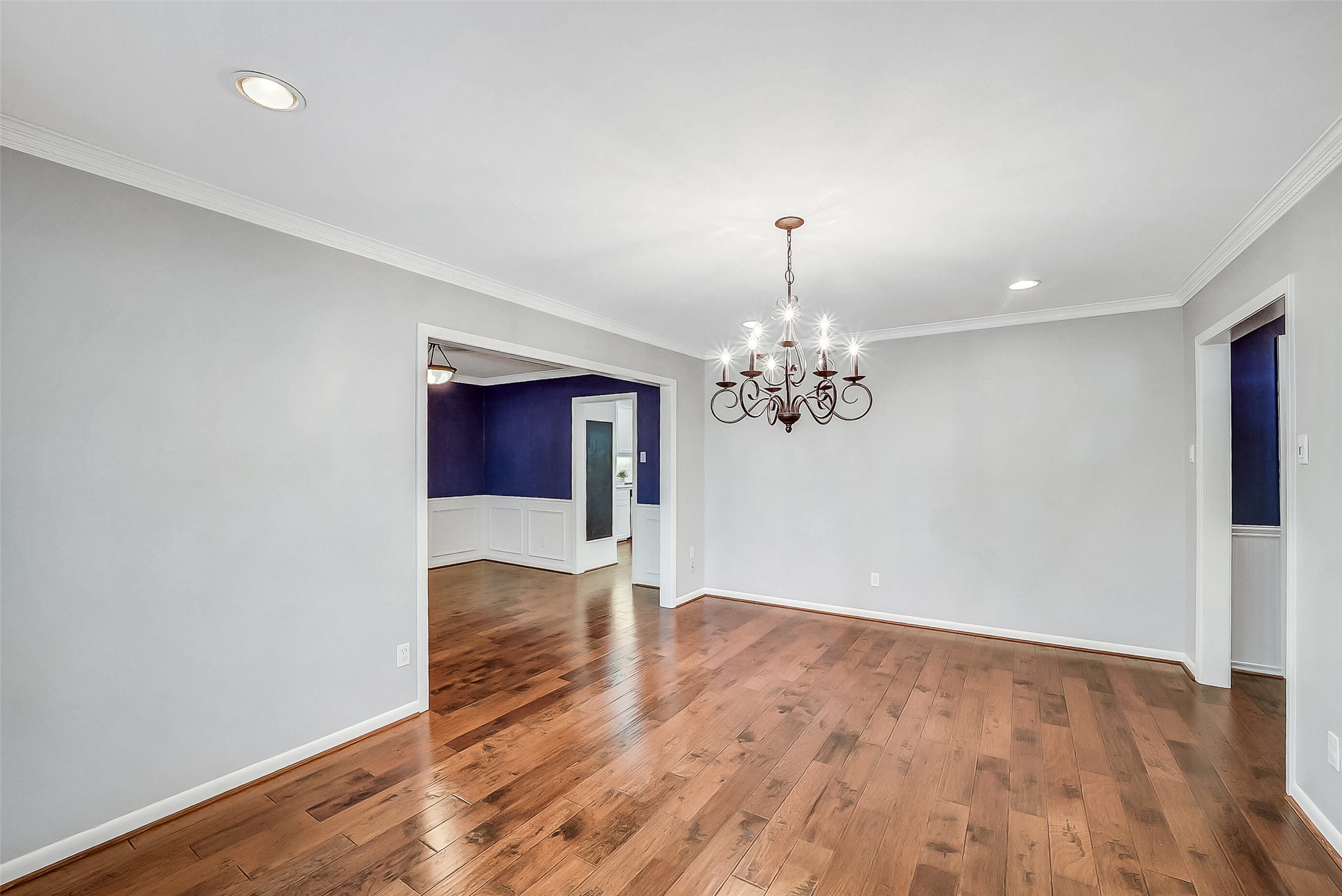 10026 Overbrook Lane Houston, TX 77042 - Photo 8 of 29 Another view of this light-filled formal space featuring hardwood flooring and seamless flow into the study. Generous proportions and refined finishes create a flexible layout perfect for both entertaining and everyday living. This photo is virtually staged.