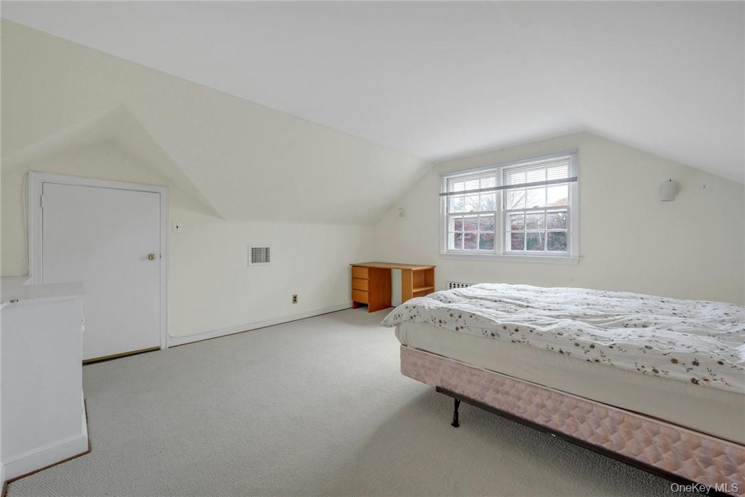 29 Old Orchard Road Rye Brook, NY 10573 - Photo 16 of 32 a bedroom with a bed and window