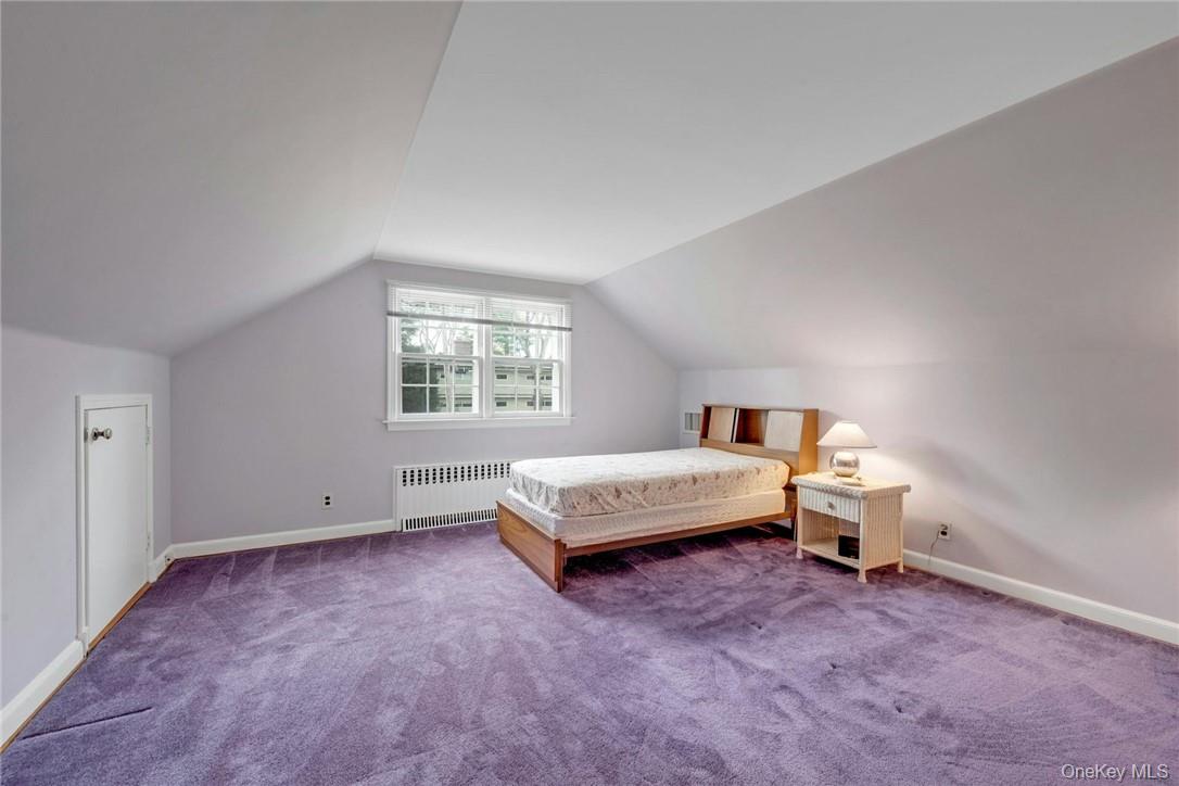 29 Old Orchard Road Rye Brook, NY 10573 - Photo 18 of 32 a bedroom with a bed and window