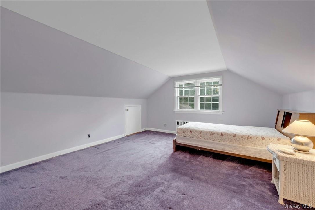 29 Old Orchard Road Rye Brook, NY 10573 - Photo 19 of 32 a spacious bedroom with a bed and a window