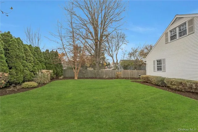 a view of a backyard of the house