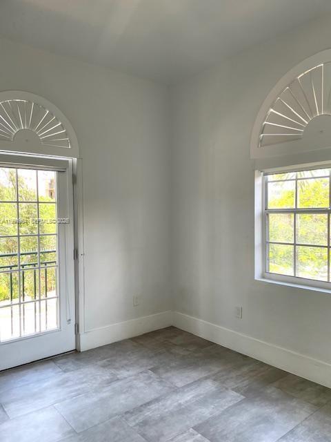 3356 Bird Avenue, Unit 10 Miami, FL 33133 - Photo 12 of 25 an empty room with a window