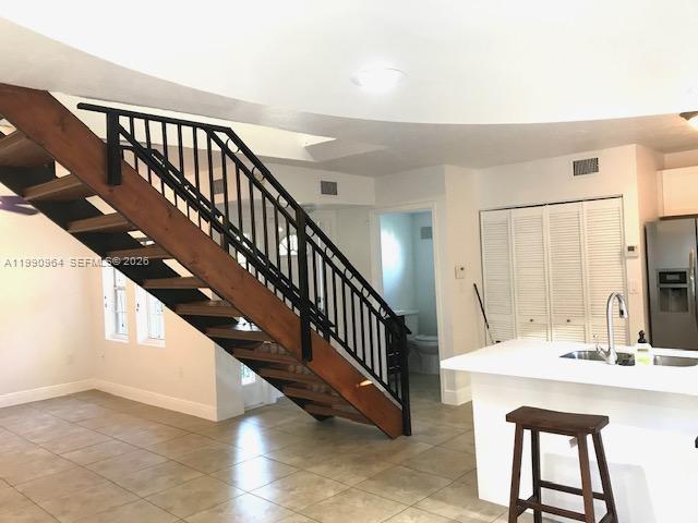 3356 Bird Avenue, Unit 10 Miami, FL 33133 - Photo 2 of 25 a view of front door with hallway and stairs