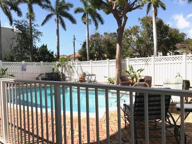 3356 Bird Avenue, Unit 10 Miami, FL 33133 - Photo 23 of 25 a view of a balcony with trees