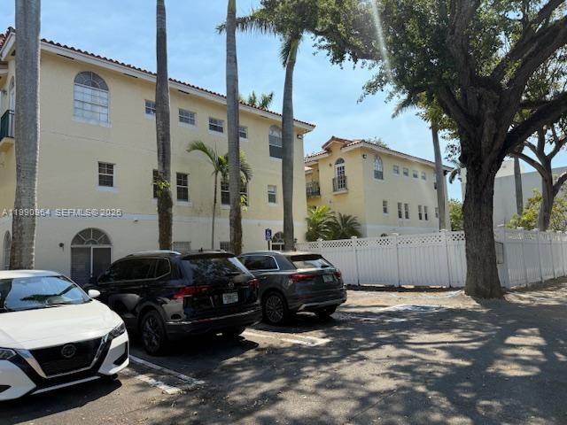 3356 Bird Avenue, Unit 10 Miami, FL 33133 - Photo 25 of 25 a couple of cars parked in front of a house