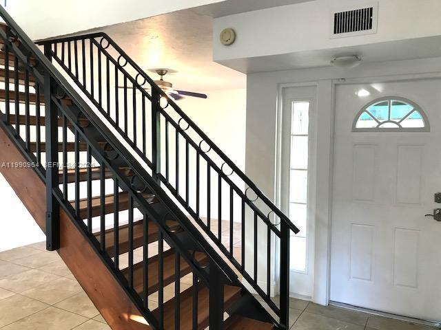 3356 Bird Avenue, Unit 10 Miami, FL 33133 - Photo 5 of 25 a view of staircase with lots of wooden floor