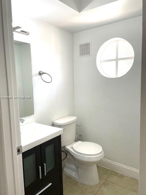 3356 Bird Avenue, Unit 10 Miami, FL 33133 - Photo 6 of 25 a bathroom with a sink and a mirror
