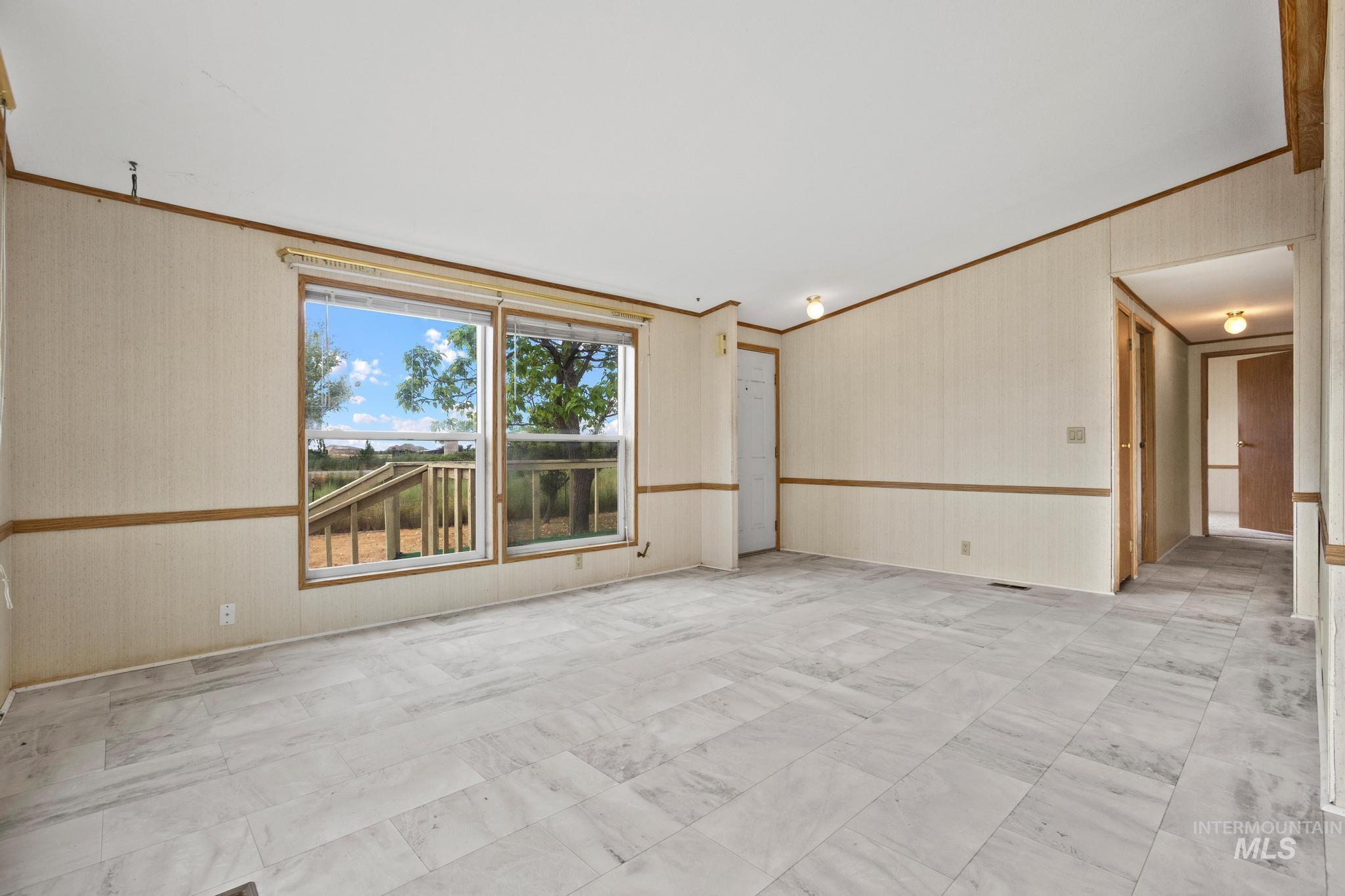 3680 South Mill Road Emmett, ID 83617 - Photo 10 of 38 Open living area featuring light-toned tile flooring and neutral wall finishes
