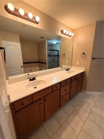 a stove top oven sitting inside of a kitchen