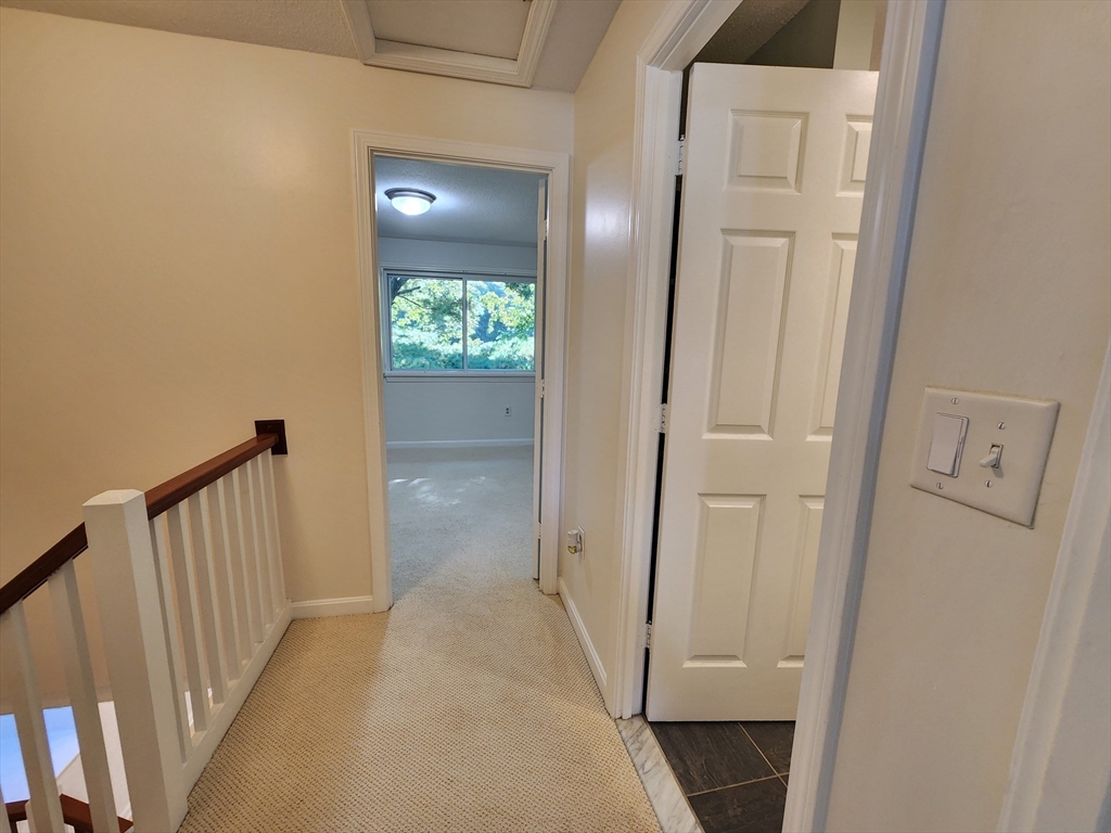 17 Beal's Cove Road, Unit A Hingham, MA 02043 - Photo 15 of 31 a view of a hallway with wooden floor and a living room