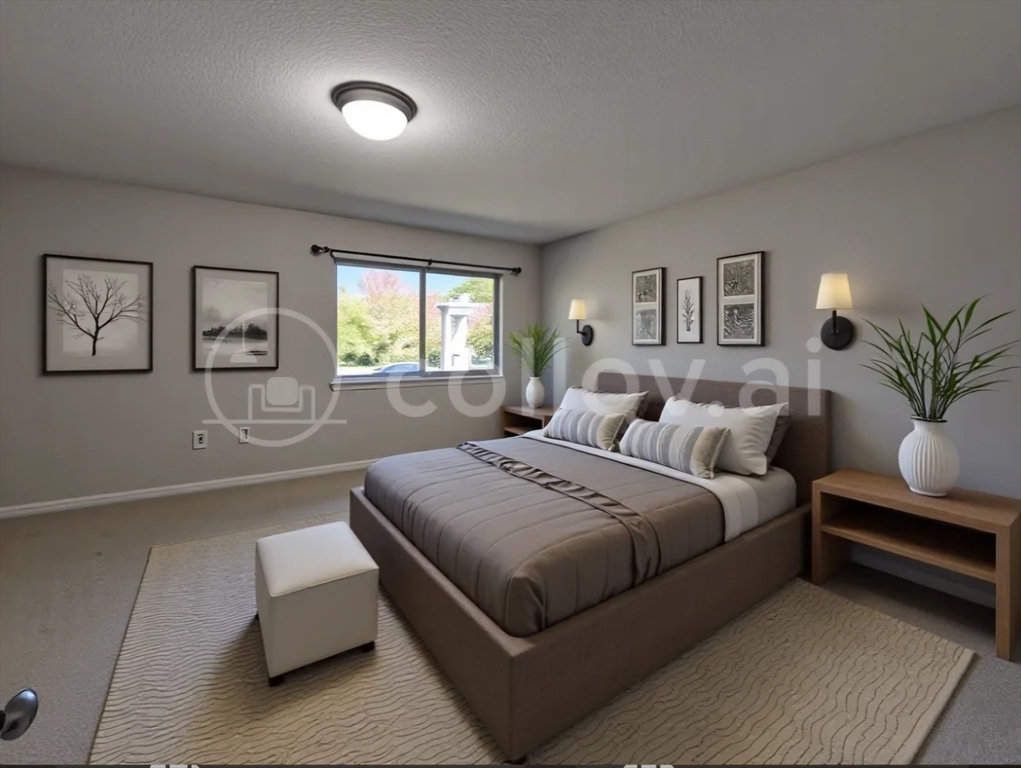 17 Beal's Cove Road, Unit A Hingham, MA 02043 - Photo 16 of 31 a bedroom with a bed and a couch