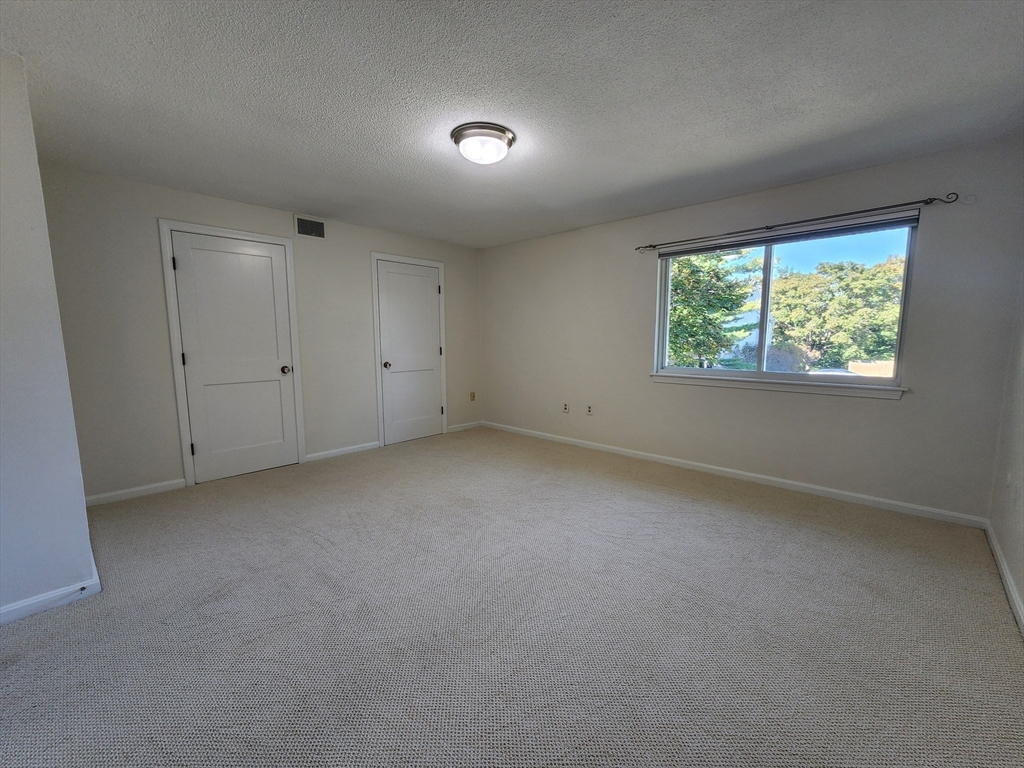 17 Beal's Cove Road, Unit A Hingham, MA 02043 - Photo 19 of 31 an empty room with windows
