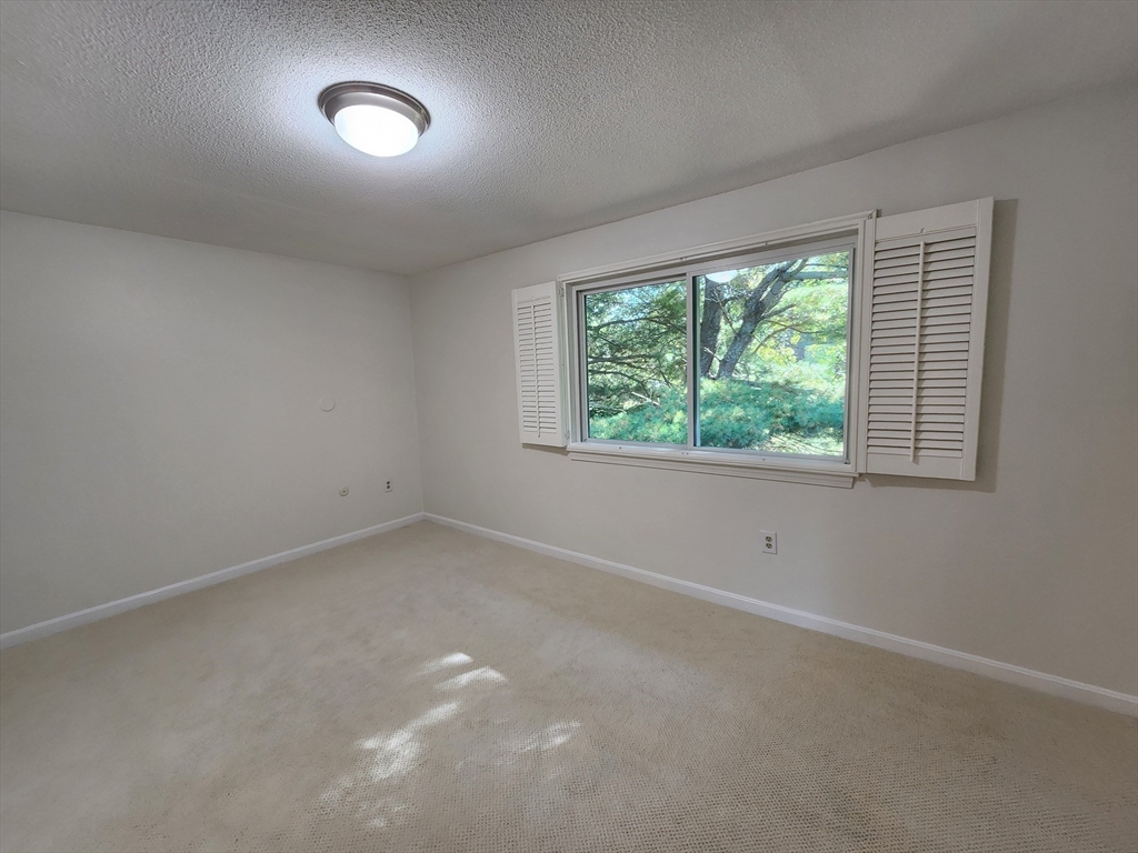 17 Beal's Cove Road, Unit A Hingham, MA 02043 - Photo 24 of 31 an empty room with a window