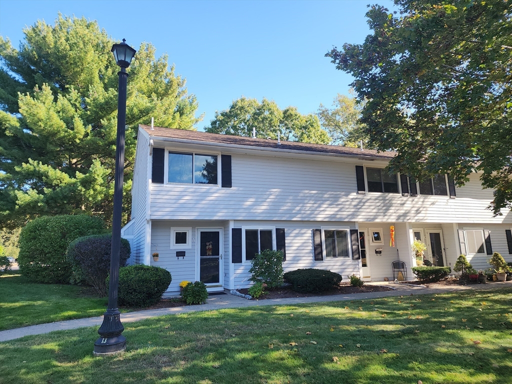 17 Beal's Cove Road, Unit A Hingham, MA 02043 - Photo 31 of 31 a front view of a house with garden and porch