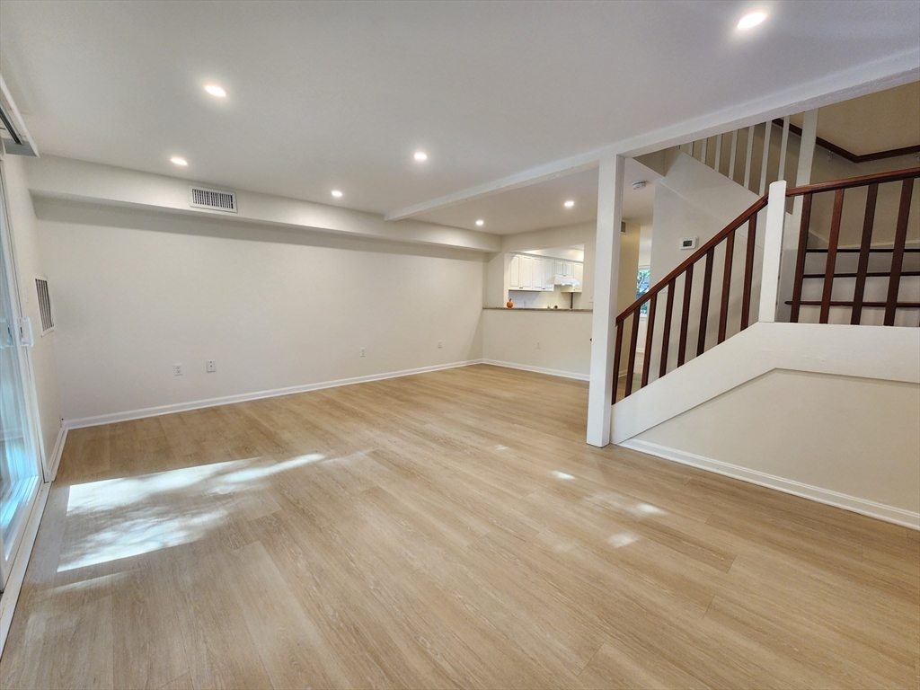 17 Beal's Cove Road, Unit A Hingham, MA 02043 - Photo 4 of 31 a view of an empty room with stairs