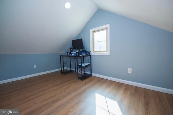 a view of workspace with wooden floor