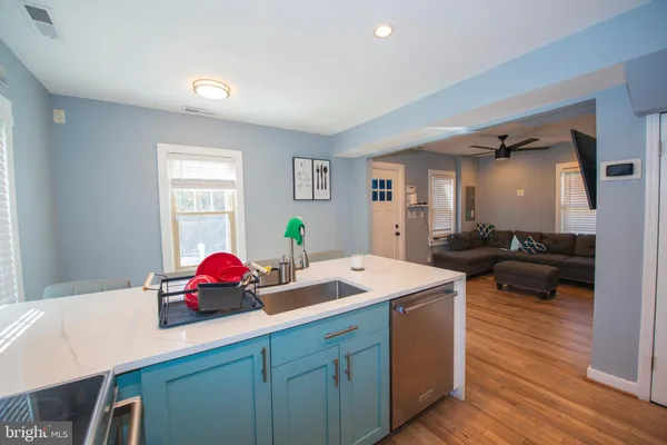 a view of a room that has a couch and a table in it