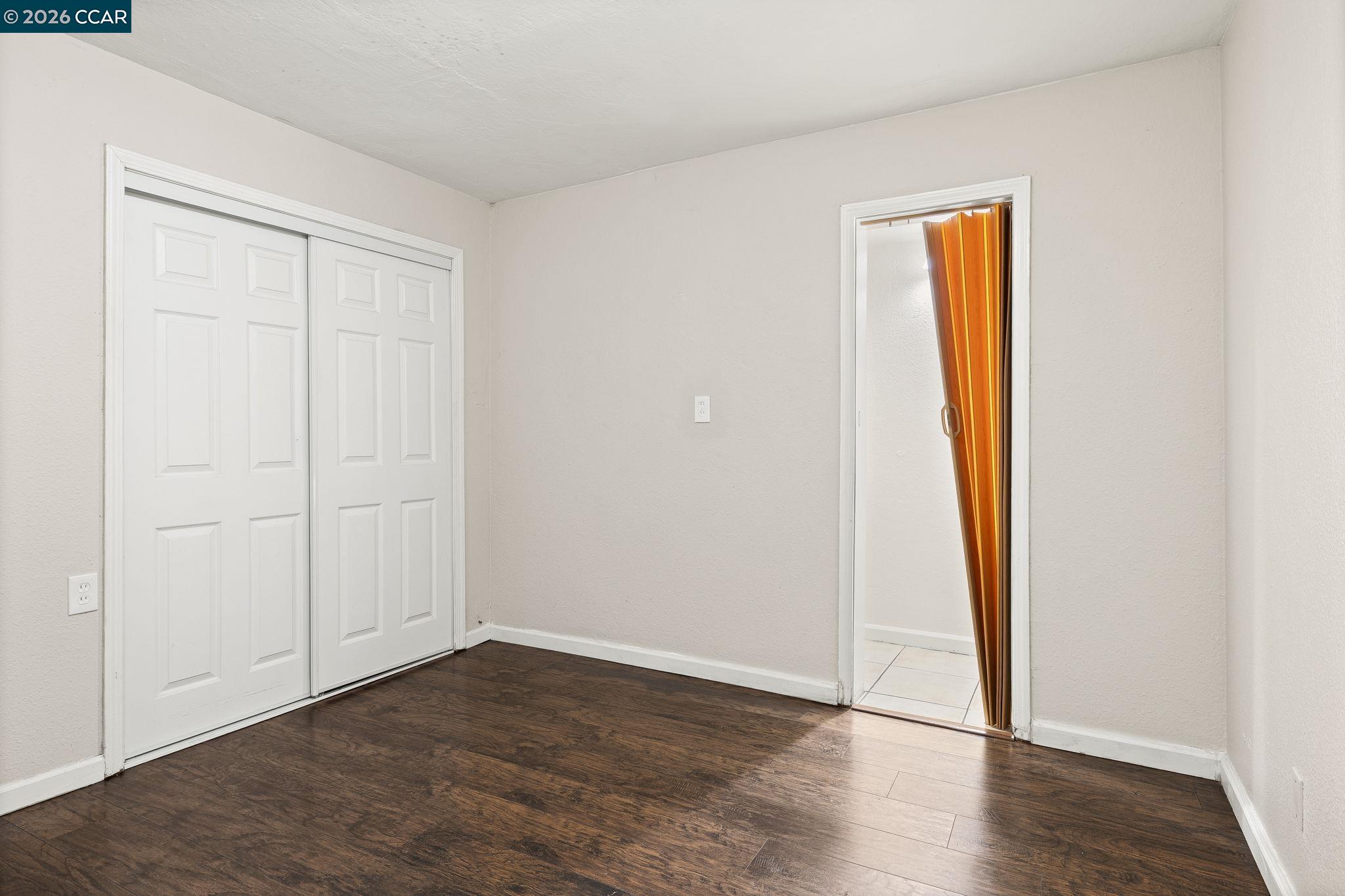 4820 Blum Road Martinez, CA 94553 - Photo 35 of 46 an empty room with wooden floor and closet