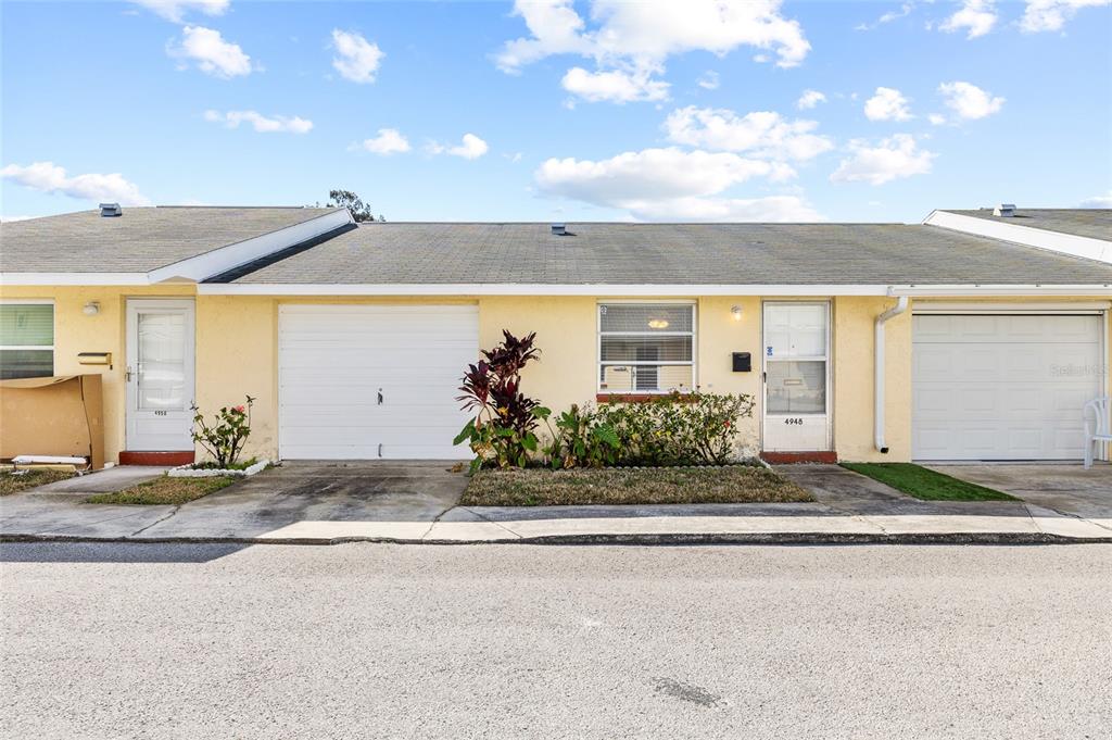 4948 Getner Street New Port Richey, FL 34652 - Photo 3 of 20 a front view of a house with a yard
