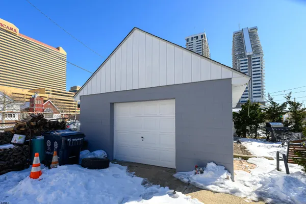 a kitchen with a sink refrigerator and cabinets