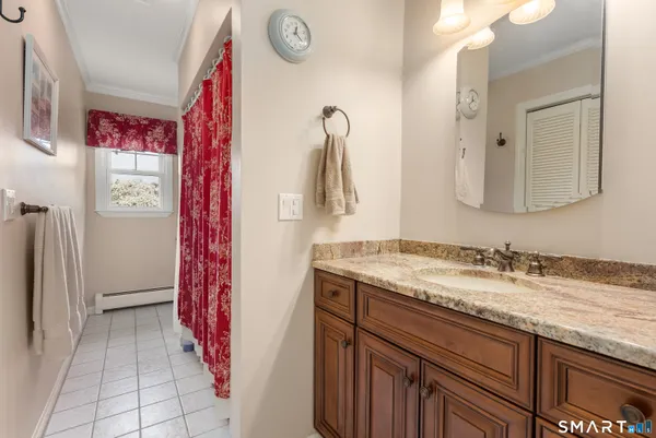 a view of a kitchen with fridge and a sink