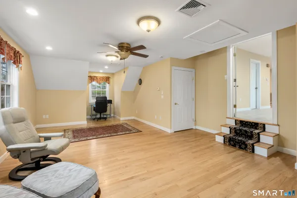 a kitchen with stainless steel appliances granite countertop a sink counter space and a window